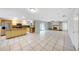 Open kitchen with stainless appliances and tile flooring, perfect for entertaining at 605 Citrus Ct, Largo, FL 33770