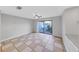 Inviting living room with tile flooring and sliding door to the patio at 605 Citrus Ct, Largo, FL 33770