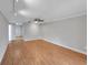 Spacious living room with light gray walls, ceiling fan, and wood-look flooring at 605 Citrus Ct, Largo, FL 33770