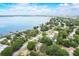 Breathtaking aerial view of a coastal community with stunning waterfront scenery and lush foliage at 611 Shore E Dr, Oldsmar, FL 34677