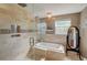 Bathroom featuring a glass shower with soaking tub, granite vanity and modern finishes at 611 Shore E Dr, Oldsmar, FL 34677