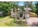 Charming two-story home with landscaped front yard and a welcoming entrance at 611 Shore E Dr, Oldsmar, FL 34677