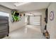 Garage with epoxy flooring, storage solutions, and an overhead door at 611 Shore E Dr, Oldsmar, FL 34677