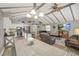 Open-concept living space showcasing a kitchen, dining area and a comfortable seating area with vaulted ceiling at 611 Shore E Dr, Oldsmar, FL 34677