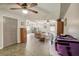 An open living room design with neutral walls, tile floors, and view to another living area at 611 Shore E Dr, Oldsmar, FL 34677
