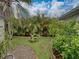 Secluded backyard showcasing a small garden area with stone paver accents at 6202 7Th S Ave, Gulfport, FL 33707
