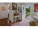 Bright and inviting foyer with hardwood floors, decorative art, and a view of the front yard at 6202 7Th S Ave, Gulfport, FL 33707