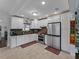 Modern kitchen featuring white cabinets, stainless steel appliances, and a stylish backsplash at 6202 7Th S Ave, Gulfport, FL 33707