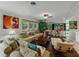 Cozy living room with ample seating, natural light, and decorative plants, offering a comfortable space at 6202 7Th S Ave, Gulfport, FL 33707