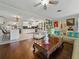 Spacious living room flowing into the kitchen, featuring hardwood floors and comfortable seating at 6202 7Th S Ave, Gulfport, FL 33707