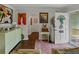 Stylish living room featuring hardwood floors, archway, decorative art, and front door entrance at 6202 7Th S Ave, Gulfport, FL 33707