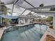 Inviting screened-in pool area with ample seating, a covered lounge, and stylish patio furniture at 6202 7Th S Ave, Gulfport, FL 33707