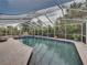 Screened-in pool with patio and landscaping that offers a private backyard oasis at 6202 7Th S Ave, Gulfport, FL 33707