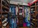 Spacious walk-in closet with custom shelving, hanging rods, and ample storage for clothes and accessories at 6202 7Th S Ave, Gulfport, FL 33707
