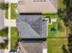 Aerial view of a home with a backyard playset and outdoor patio at 6214 Windship Ct, Tampa, FL 33647