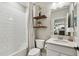 Neutral bathroom features subway tiled shower and shelves at 6214 Windship Ct, Tampa, FL 33647