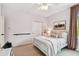 Bedroom with a ceiling fan, bed, and a single window at 6214 Windship Ct, Tampa, FL 33647