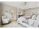 Main bedroom suite with seating, tray ceiling and ensuite bath at 6214 Windship Ct, Tampa, FL 33647