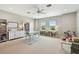 Spacious bonus room with carpeted floors, white built-ins, and versatile layout at 6214 Windship Ct, Tampa, FL 33647