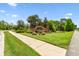 Community entrance with lush landscaping and a decorative sign at 6214 Windship Ct, Tampa, FL 33647