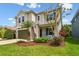 Attractive two-story home with a well-manicured lawn, mature landscaping, and a two-car garage at 6214 Windship Ct, Tampa, FL 33647