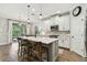 Modern eat-in kitchen featuring a center island with bar stool seating, and stainless steel appliances at 6214 Windship Ct, Tampa, FL 33647
