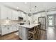 Kitchen featuring granite countertops, stainless steel appliances, and an island with bar seating at 6214 Windship Ct, Tampa, FL 33647