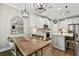 Kitchen, dining area, and living area featuring quartz countertops and stainless steel appliances at 6214 Windship Ct, Tampa, FL 33647