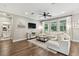 Comfortable living room with hardwood floors, a ceiling fan, and lots of natural light at 6214 Windship Ct, Tampa, FL 33647