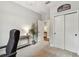 Home office features a closet, modern lighting, and neutral decor at 6214 Windship Ct, Tampa, FL 33647