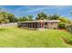 Expansive backyard showcasing lush green lawn and a charming outdoor patio area for leisure and entertainment at 6635 9Th N Ave, St Petersburg, FL 33710