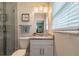 Bright bathroom featuring a granite countertop vanity and walk-in shower with glass door and tiled surround at 6635 9Th N Ave, St Petersburg, FL 33710