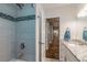Modern bathroom with a tiled shower and granite countertop vanity, creating a spa-like experience at 6635 9Th N Ave, St Petersburg, FL 33710