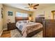 Cozy bedroom with a plush rug, ceiling fan, and wood furniture, creating a comfortable retreat at 6635 9Th N Ave, St Petersburg, FL 33710