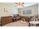 Comfortable bedroom featuring multiple cribs and dressers, with good natural light, perfect for a growing Gathering at 6635 9Th N Ave, St Petersburg, FL 33710