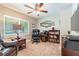 Functional home office featuring a ceiling fan, a comfortable chair, and ample desk space for productivity at 6635 9Th N Ave, St Petersburg, FL 33710