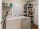 Convenient laundry room featuring a Whirlpool washer and dryer, offering efficiency and functionality at 6635 9Th N Ave, St Petersburg, FL 33710