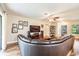 Spacious living room featuring a comfortable sectional sofa, entertainment center, and hardwood floors at 6635 9Th N Ave, St Petersburg, FL 33710
