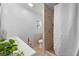 Bright bathroom featuring a tiled shower with glass door, modern sink and neutral decor at 6807 N Himes Ave, Tampa, FL 33614