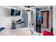 Cozy bedroom with a bed, TV, and a ceiling fan, with a neutral color scheme promoting relaxation at 6807 N Himes Ave, Tampa, FL 33614
