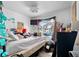 This bedroom features a ceiling fan, wall-mounted TV, and lots of room for personalization at 6807 N Himes Ave, Tampa, FL 33614