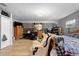 Large bedroom with wood-look floors, neutral colored walls, and a ceiling fan at 6807 N Himes Ave, Tampa, FL 33614