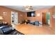 Comfortable living room with neutral colored walls, tiled floor, and access to other rooms at 6807 N Himes Ave, Tampa, FL 33614