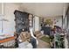 Screened porch with storage containers and other items, offering practical outdoor space at 6807 N Himes Ave, Tampa, FL 33614