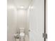 A half bathroom features tile floors, a white door, and a standard toilet at 6961 King Creek Dr, Sun City Center, FL 33573