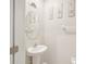 Cozy bathroom featuring a pedestal sink and neutral decor at 6961 King Creek Dr, Sun City Center, FL 33573