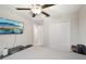 Bedroom with a ceiling fan, closet, television, and neutral decor at 6961 King Creek Dr, Sun City Center, FL 33573
