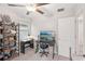 Bedroom featuring ceiling fan, a desk with a monitor, and a bookshelf at 6961 King Creek Dr, Sun City Center, FL 33573
