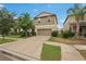 Charming two-story home with a well-maintained lawn and driveway at 6961 King Creek Dr, Sun City Center, FL 33573