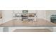 Granite island features stainless sink and ample countertop space at 6961 King Creek Dr, Sun City Center, FL 33573